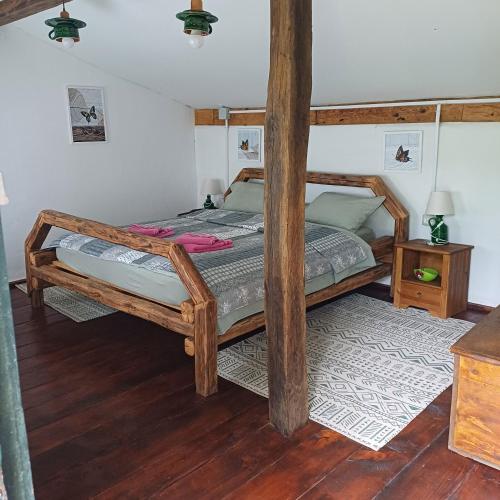 a bedroom with a bunk bed and a wooden floor at Valchid Guest House in Valchid