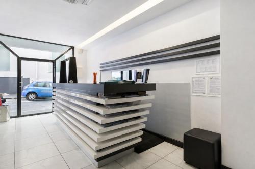 a staircase in a room with a view of a car at Hotiday Napoli Porto in Naples