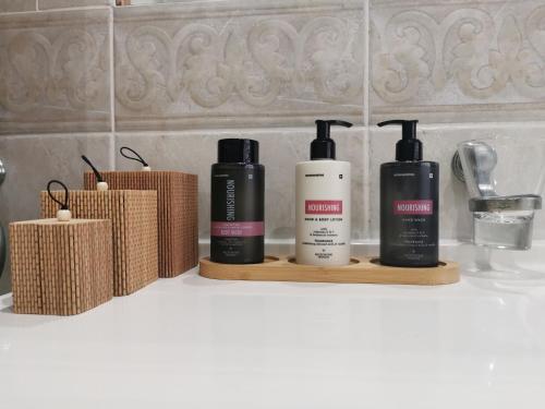 three bottles of hair products sitting on a counter at The Boho Suite in Benoni