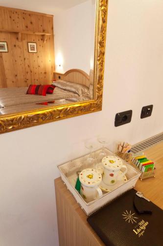 Postel nebo postele na pokoji v ubytování Hotel Livigno