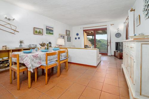 a kitchen and dining room with a table and chairs at Marana Orizzonte in Santa Marinella