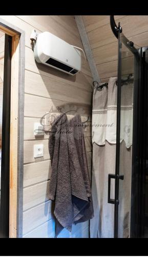 a room with a heater and towels on a wall at la marmotte in Granges-Aumontzey