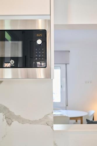 a microwave oven sitting on top of a counter at CASA CALMA Blanes in Blanes