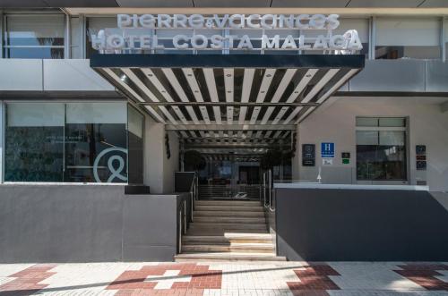 a building with a sign on the side of it at Hotel Costa Málaga - Adults Recommended - by Pierre & Vacances in Torremolinos