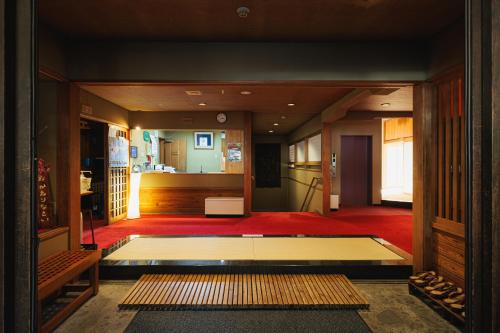 a view of a living room with a floor at Ryokan Warabino in Takayama