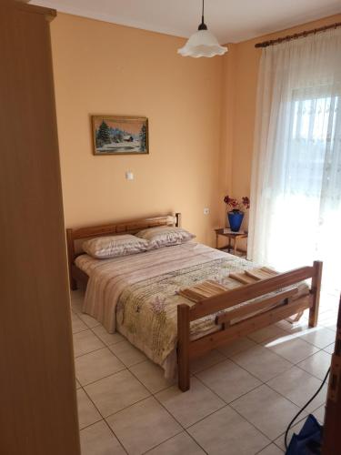 Ένα ή περισσότερα κρεβάτια σε δωμάτιο στο Kitros