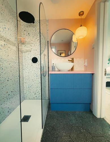 a bathroom with a sink and a mirror at The Nest in Bristol