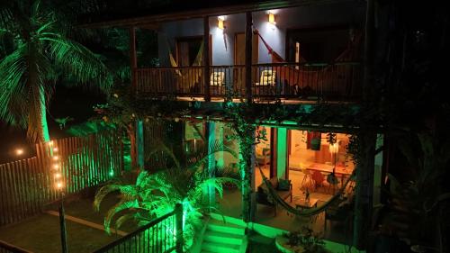 an overhead view of a house with a swimming pool at night at Céu e Mar Itacaré in Itacaré