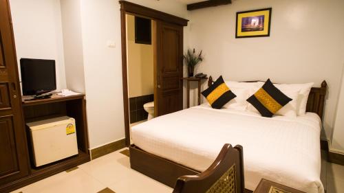 Katil atau katil-katil dalam bilik di Family Boutique Hotel