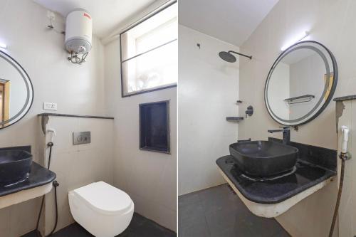 a bathroom with a sink and a toilet and a mirror at FabHotel NA Grand in Chennai