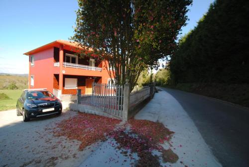 a car parked in front of a house at As Neveiras in Millerada