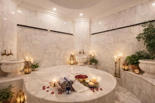 a large room with a round table with candles at Hotel Vita Bella Resort & Spa in Gundogan