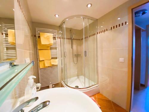a bathroom with a shower and a sink at Appartement Bergschaf in Holzgau