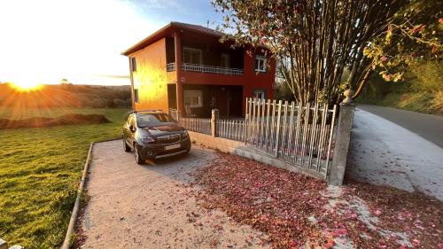 a car parked in front of a house at As Neveiras in Millerada