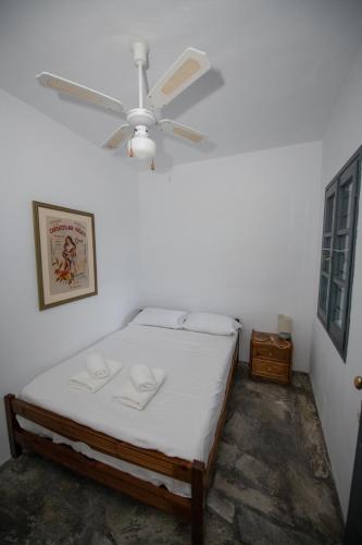 a bedroom with a bed and a ceiling fan at Aegean Dream in Klíma