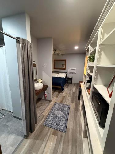 a small room with a bathroom and a bedroom at Germantown Inn & Lounge in Hermann