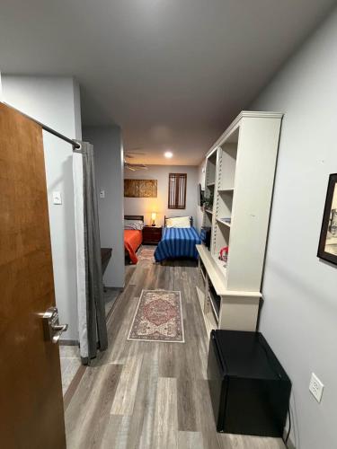 a room with a staircase and a living room at Germantown Inn & Lounge in Hermann