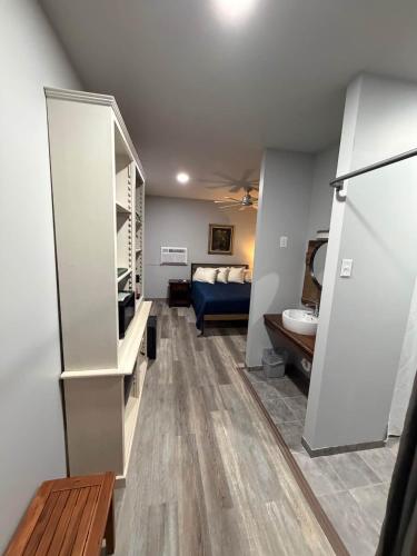 a living room with a couch and a bed in a room at Germantown Inn & Lounge in Hermann