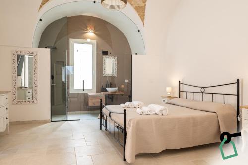 a bedroom with two beds with towels on them at Hotiday Gallipoli Castello in Gallipoli