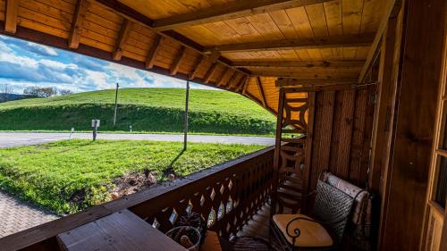 a view from the balcony of a cabin with a view of a field at Gästehaus Holzer Kreuz- Gästezimmer Margerite für 2 Personen inkl Landfrühstück in Fröhnd