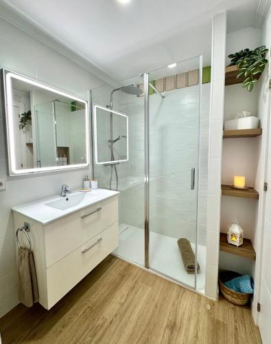 a bathroom with a shower and a sink at Albers Apartment in Port d'Alcudia