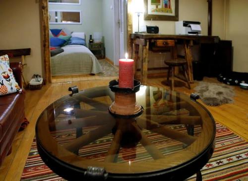 a living room with a candle on top of a table at FOLK in Old Town in Kecskemét