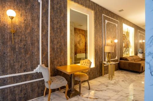 a living room with a table and two chairs at Orange Hotel & Spa in Şişli