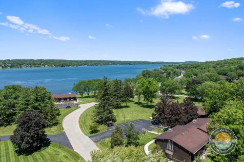 an aerial view of a house with a lake at Lake Como Condo with Lake Views and Pool in Lake Geneva