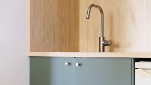 a kitchen with a sink and a blue cabinet at Virginia N302 - 2p4 in Grasse
