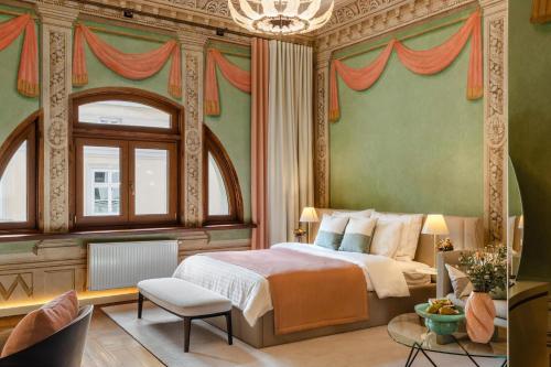 a bedroom with a bed and a large window at Residence 9 in Krakow