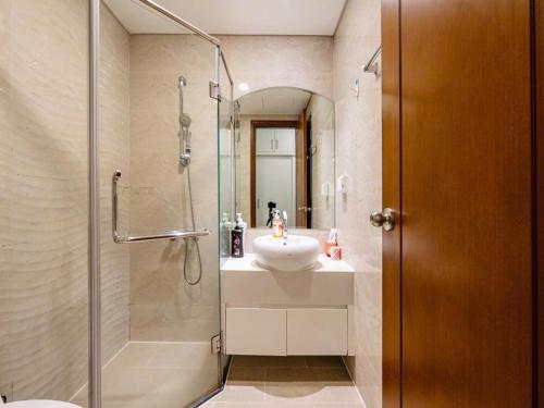a bathroom with a sink and a shower at Landmark City View - Apartment in Ho Chi Minh City