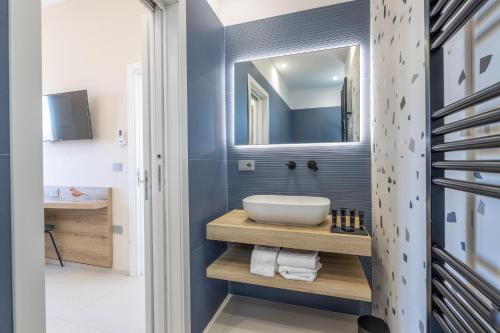 a bathroom with a sink and a mirror at Dimora Suite Idro in Gallipoli