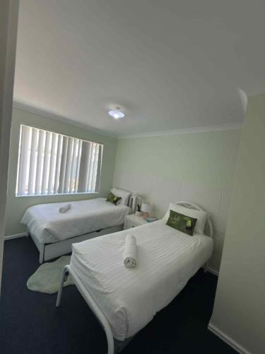 a hospital room with two beds and a window at Lakeside view in Cuthbert