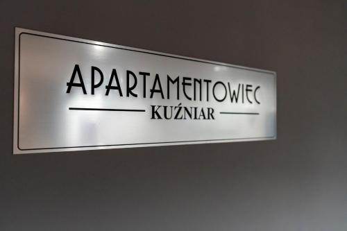 a sign for a manufacturing institute of kunner at Apartamentowiec Kuźniar in Kostrzyn nad Odrą