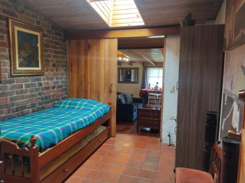 a bedroom with a bed in a room at Tu Casa - Hotel Rural in Sopó
