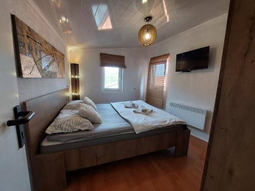a small bedroom with a bed in a room at Ester in Kastav