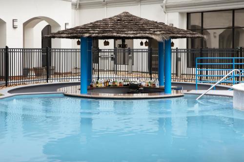 a gazebo next to a swimming pool at Courtyard by Marriott San Antonio SeaWorld Westover Hills in San Antonio