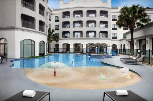 a large swimming pool in front of a building at Courtyard by Marriott San Antonio SeaWorld Westover Hills in San Antonio