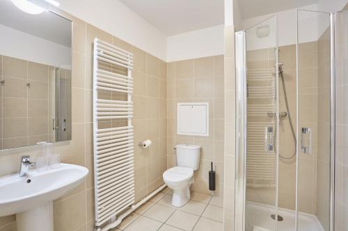 a bathroom with a toilet and a sink and a shower at MAISON SAINT CHARLES - ASSOCIATION HABITAT et HUMANISME ILE DE FRANCE in Paris