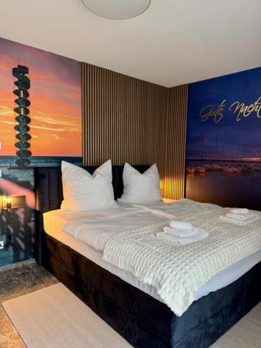 a bedroom with a large bed with white sheets at See you! in Pouch
