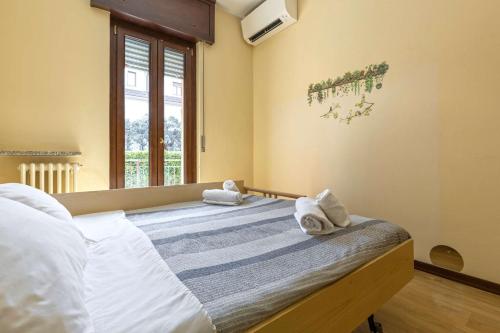 a bedroom with two beds with towels on them at Sleep & Fly - Immobili e Soluzioni Rent in Orio al Serio