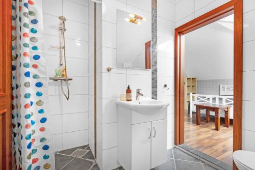 a bathroom with a sink and a shower at Villa Stavanger 5 bedrooms 5 bathrooms and large swimming pool in Stavanger