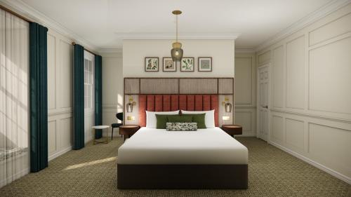a bedroom with a large bed in a room at Parade Hotel Bath in Bath