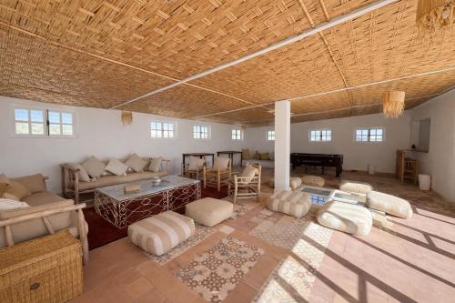 a large living room with a couch and a table at Pistach Océan Maison 4 chambres vue Océan in Wassane