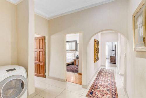 a laundry room with a washer and dryer at The Adress beautiful in Midrand