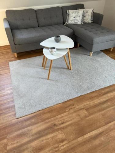 a living room with a couch and a white coffee table at Inselhus in Burg auf Fehmarn