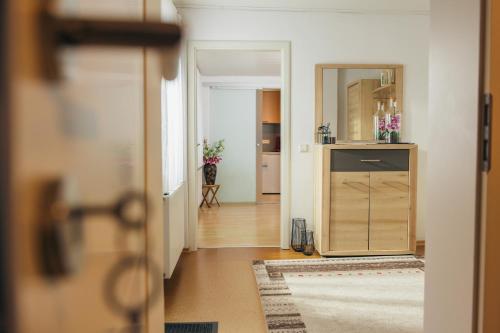 a hallway with a door open to a room at Ferienlodge bei den Reben in Sankt Margarethen im Burgenland