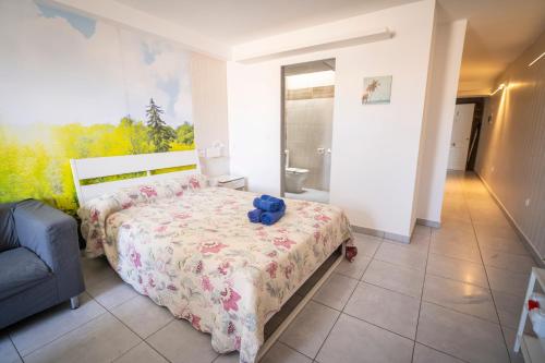 a bedroom with a bed with a teddy bear on it at Edificio Prieto VIV 7 in Puerto del Rosario