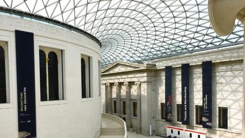 a building with a glass domed ceiling in a museum at Ruby Stella Hotel London by IHG in London