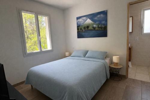 a bedroom with a bed and two windows at La Parenthèse d'Hasparren - Avec Parking Privé in Hasparren